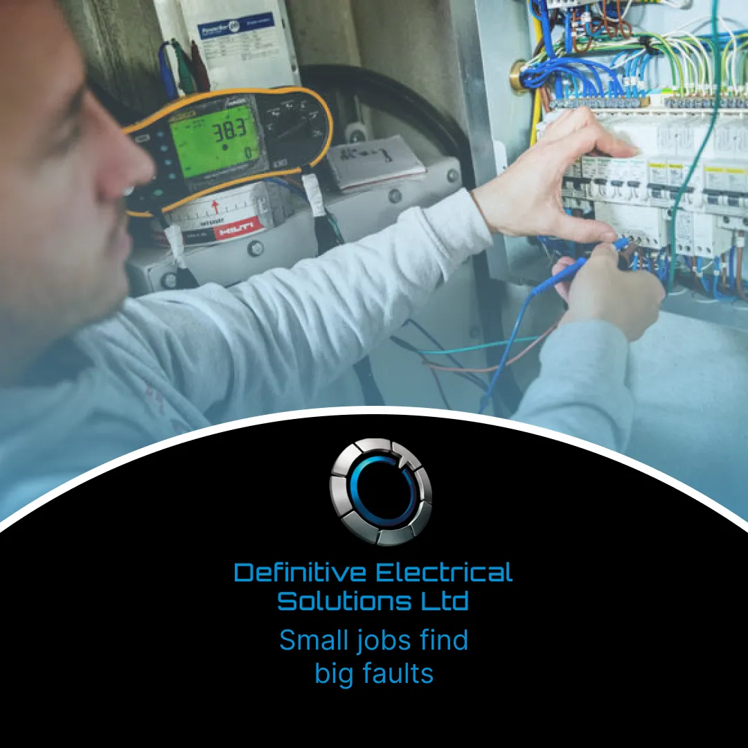 Electrician working on a control panel with wires and tools.