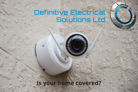 picture of a security camera on a wall with Definitive Electrical logo in the corner