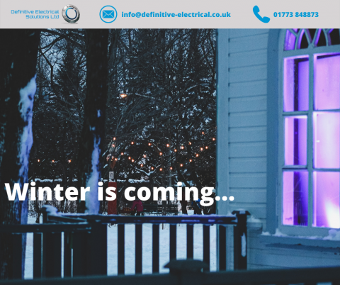 outside winter scene with fairy lights and light coming from a nearby window