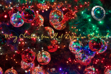 An image of Christmas baubles and lights on a tree