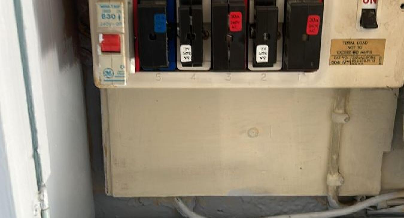 Do I need to upgrade my consumer unit? Image of an old outdated fuse box